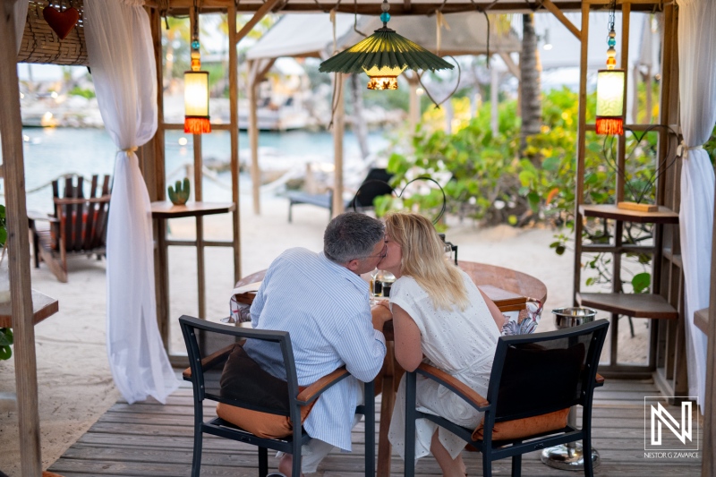 Couple shares a wedding proposal moment at Baoase Luxury Resort in Curacao under warm evening light