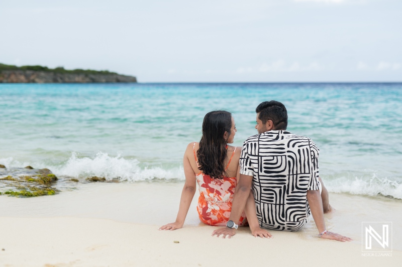 Couple Enjoying a Sunny Day on the Beach With Gentle Waves Lapping at Their Feet in a Tropical Location During Late Afternoon