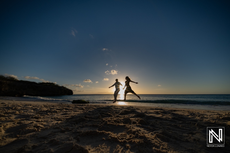 Couple celebrates wedding proposal at Knip beach in Curacao during sunset