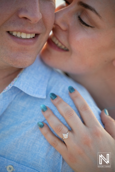 Couple celebrates wedding proposal at Knip beach in Curacao during golden hour