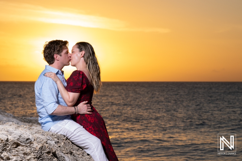Couple celebrates wedding proposal at Knip Beach in Curacao during sunset