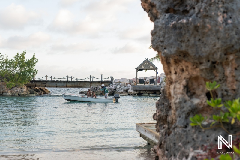 Romantic wedding proposal at sunset on the serene shores of Baoase Luxury Resort in Curacao