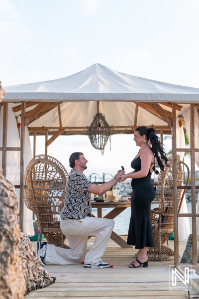 Romantic wedding proposal at sunset in Curacao at a luxurious resort setting with an intimate atmosphere