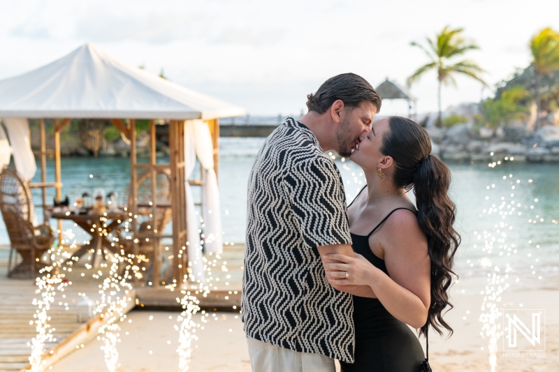 Romantic wedding proposal during sunset at Baoase Luxury Resort in Curacao with a memorable kiss by the beach