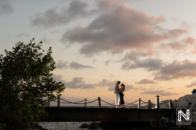 Enchanting wedding proposal at sunset on a pier in Curacao