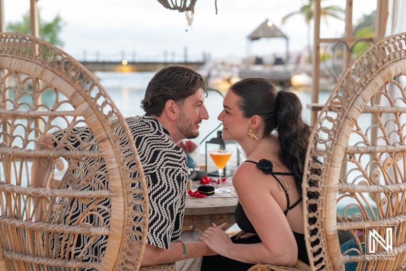 Romantic wedding proposal at sunset in Curacao, featuring an intimate moment at Baoase Luxury Resort