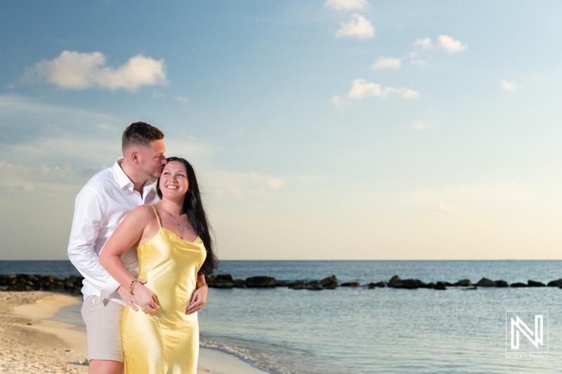 Romantic wedding proposal at sunset on the beach in Curacao with the couple enjoying a special moment near the Marriott Beach Resort