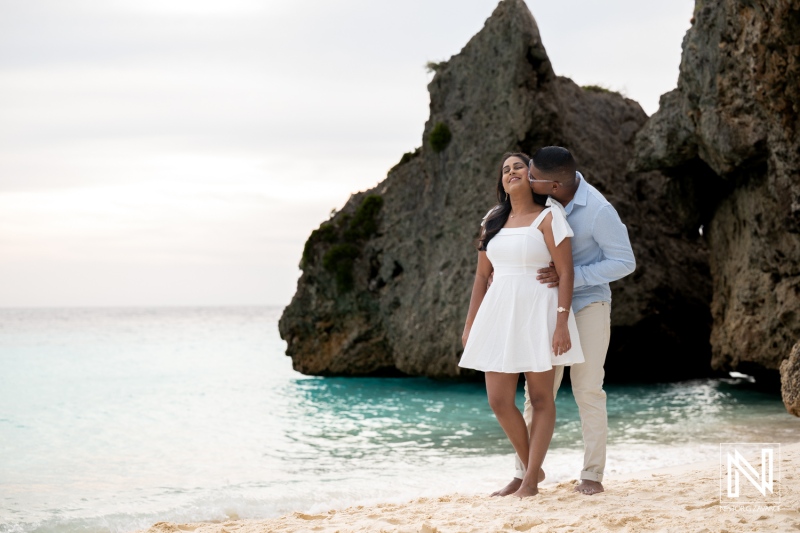 Wedding proposal at Cas Abao Beach in Curacao during sunset with couple sharing a special moment
