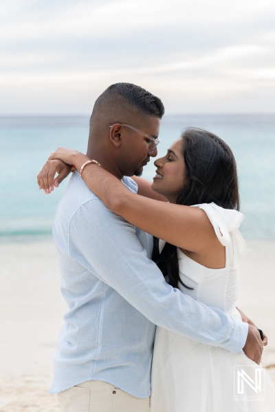Couple enjoys wedding proposal moment at Cas Abao Beach in Curacao during sunset by the ocean