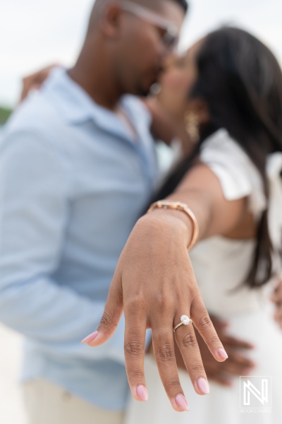 Couple shares a romantic moment during wedding proposal at Cas Abao Beach in Curacao at sunset