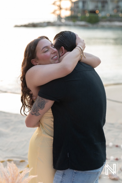 Romantic sunset proposal at Avila Beach Hotel in Curacao captures joyful couple embracing after a memorable moment together