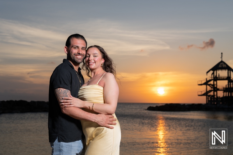 Couple enjoys a romantic sunset wedding proposal at Avila Beach Hotel in Curacao