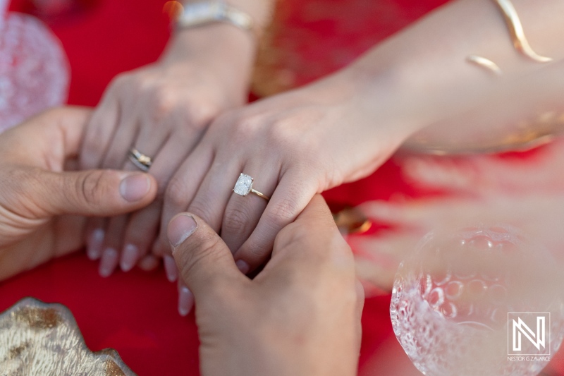 Couple shares an intimate moment during a wedding proposal at sunset at Avila Beach Hotel in Curacao