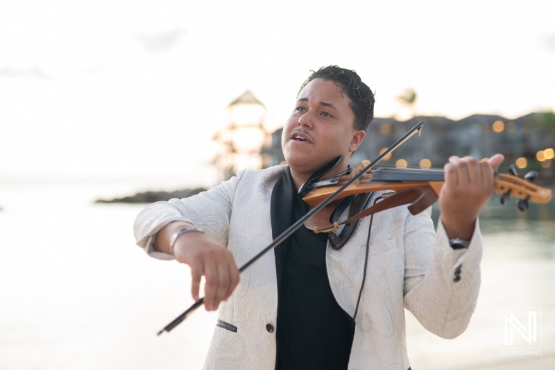 Couple celebrates romantic wedding proposal at Avila Beach Hotel during a breathtaking sunset in Curacao