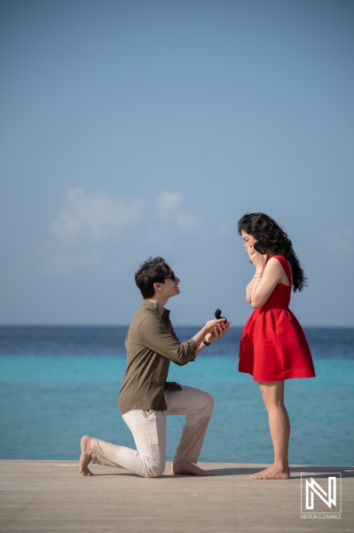Couple enjoys wedding proposal at Playa Porto Mari in Curacao during bright day