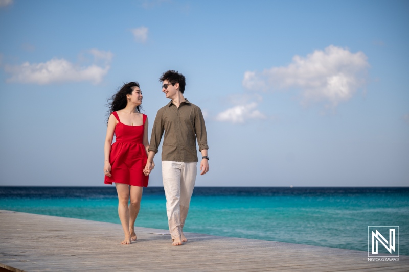Couple enjoys a wedding proposal at Playa Porto Mari in Curacao during a sunny day by the beach