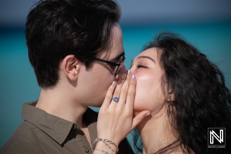 Couple shares a special moment during wedding proposal at Playa Porto Mari in Curacao
