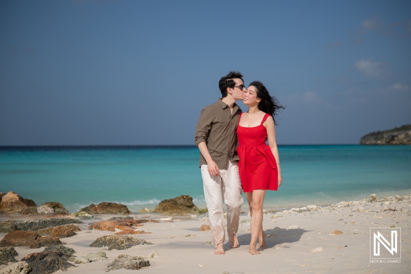 Couple shares a moment during a wedding proposal at Playa Porto Mari in Curacao