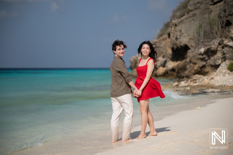 Couple shares a special moment during a wedding proposal at Playa Porto Mari