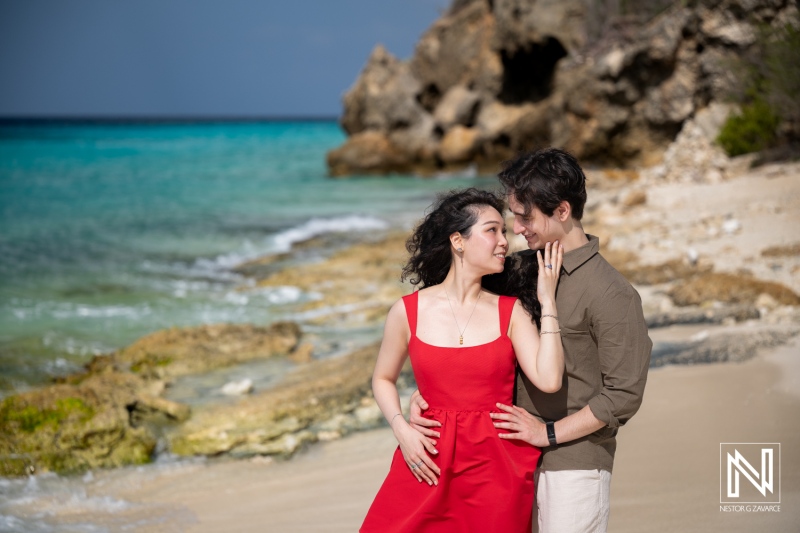 Couple shares a special moment during a wedding proposal at Playa Porto Mari in Curacao
