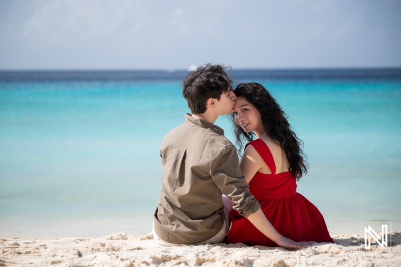 Couple engages in a wedding proposal at Playa Porto Mari in Curacao during a sunny day