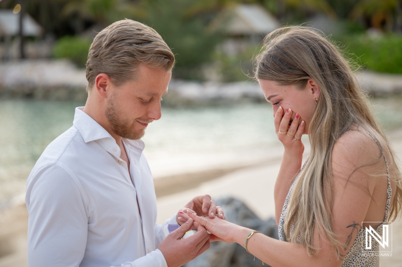 Couple enjoys wedding proposal at Baoase Luxury Resort in Curacao by the beach