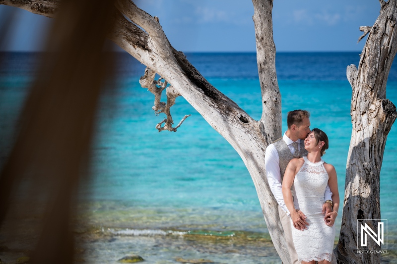 Couple enjoys Trash the Dress session at Cas Abao Beach in Curacao during sunny afternoon