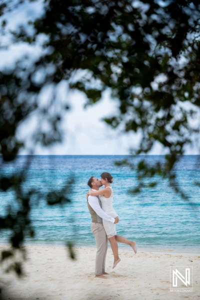 Couple enjoys Trash the Dress session at Cas Abao Beach in Curacao during a sunny day by the water