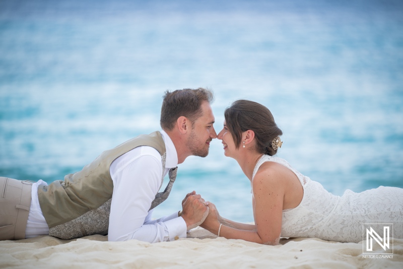 Couple enjoys trash the dress session at Cas Abao Beach in Curacao with close-up moment together