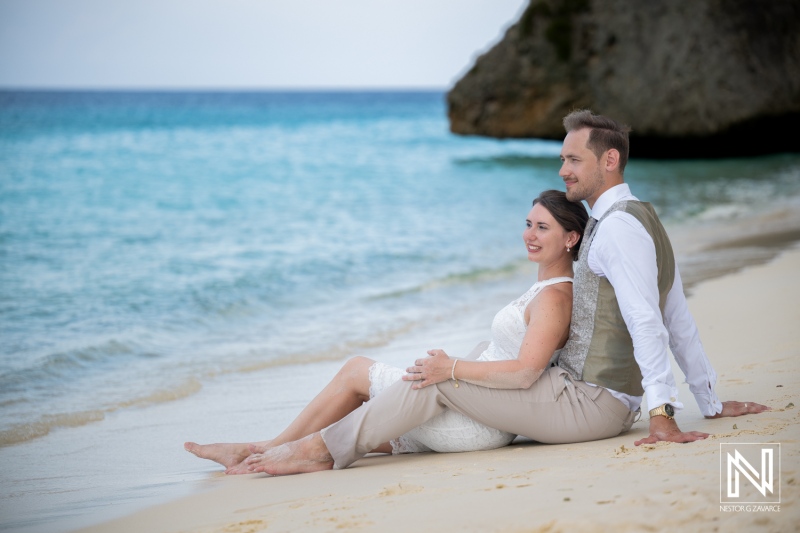 Trash the dress session at Cas Abao Beach in Curacao with couple enjoying the ocean view and soft sand