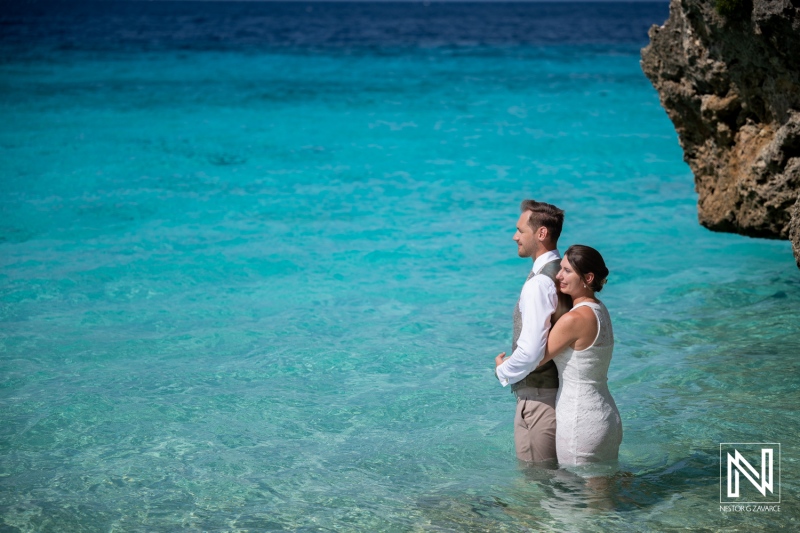 Couple enjoys trash the dress session at Cas Abao Beach in Curacao during sunny weather