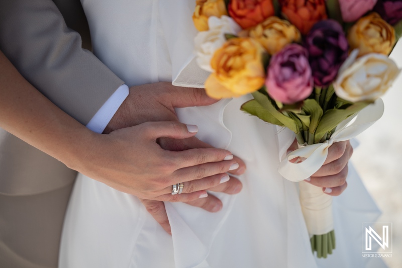 Couple relaxes at Cas Abao Beach during Trash the Dress session in Curacao on a sunny day