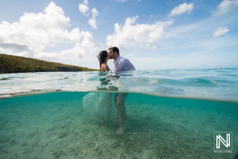 Couple enjoys Trash the Dress session at Cas Abao Beach in Curacao during sunny afternoon