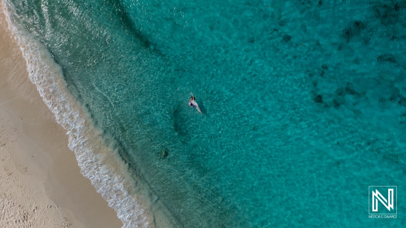 Trash the dress session at Cas Abao Beach in Curacao with clear water and sandy shore