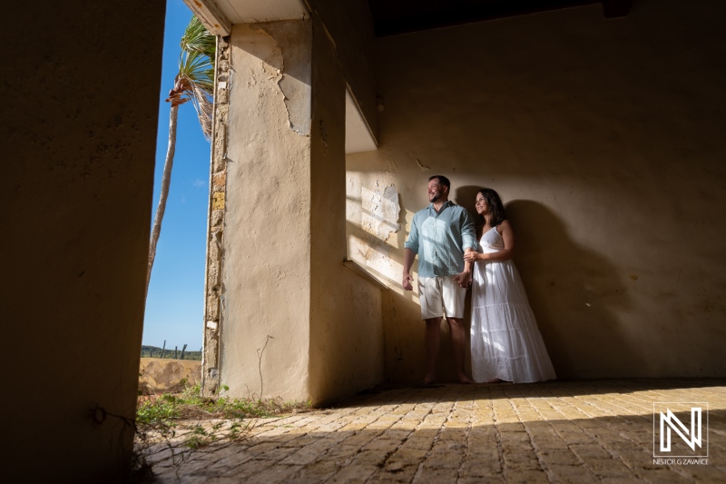 Couple embraces a romantic moment in Cas Abao, Curacao during a Trash The Dress photoshoot by the beach