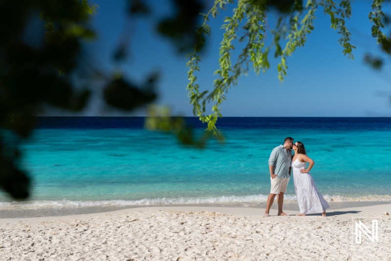 Couple enjoying a romantic moment on Cas Abao beach in Curacao during a trash the dress session