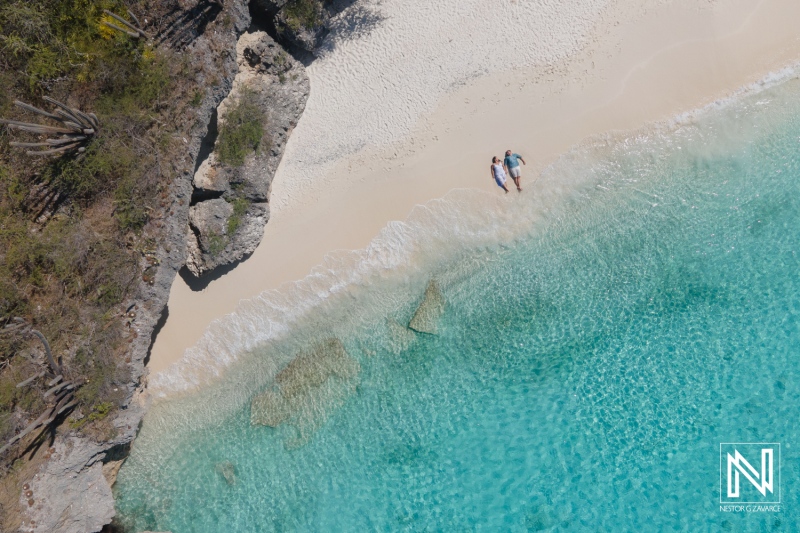 Couple enjoying a serene moment on the beautiful beach of Cas Abao in Curacao during a Trash the Dress session