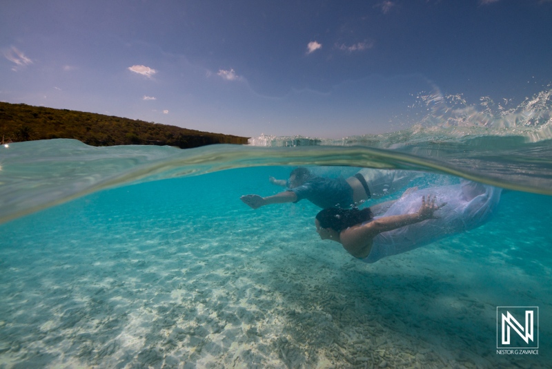 Trash the dress experience in the clear waters of Cas Abao, Curacao during a vibrant underwater session