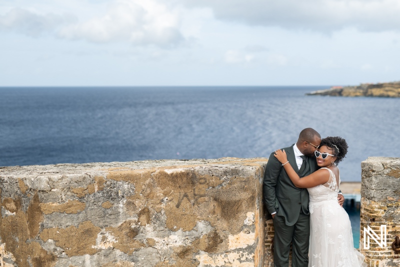 Couple Embraces on a Scenic Cliffside Overlooking the Ocean, Celebrating Their Love With a Romantic Moment During a Wedding in a Beautiful Coastal Location