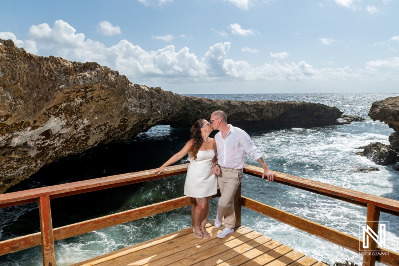 Couple shares a romantic moment during trash the dress session at Shete Boka National Park, Curacao