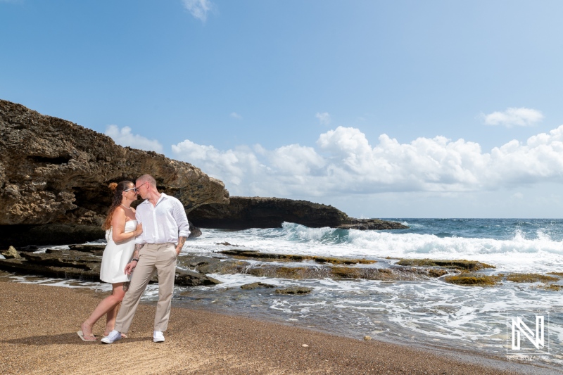 Couple enjoys their trash the dress session at Shete Boka National Park in Curacao with stunning ocean backdrop
