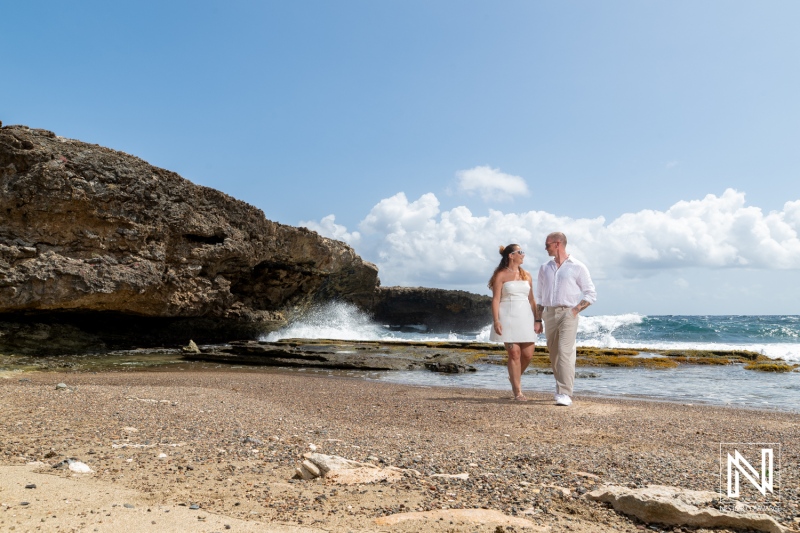Couple enjoys a romantic trash the dress session at Shete Boka National Park in Curacao under a beautiful sky