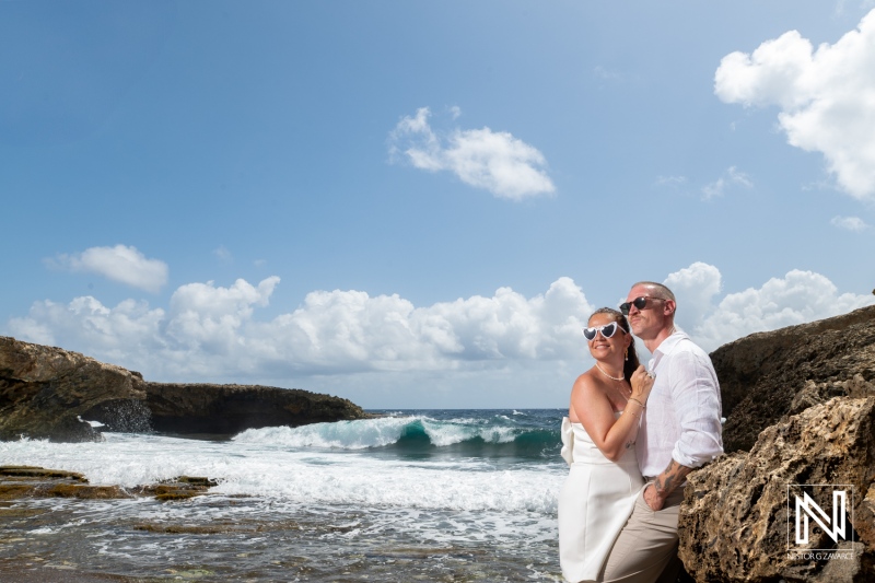 Couple enjoys a memorable trash the dress session at Shete Boka National Park in Curacao on a sunny day