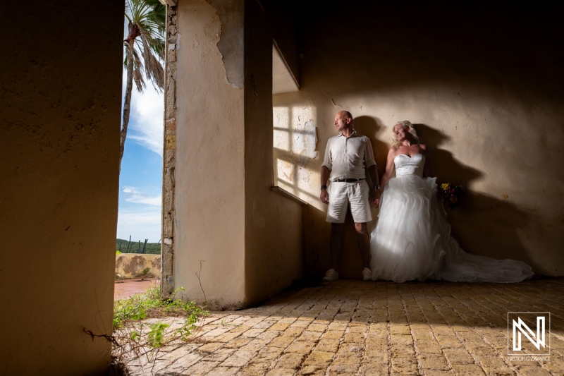 Couple enjoys Trash the Dress session at Cas Abao Beach in Curacao with stunning natural light and unique architecture