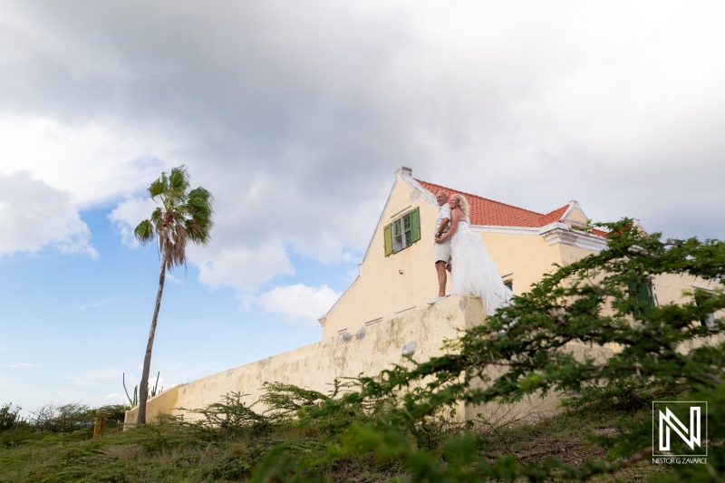 Couple celebrates love at Cas Abao Beach in Curacao with a Trash the Dress session amidst stunning landscapes