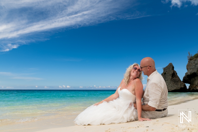 Couple enjoying a romantic moment at Cas Abao Beach during a Trash the Dress session in Curacao