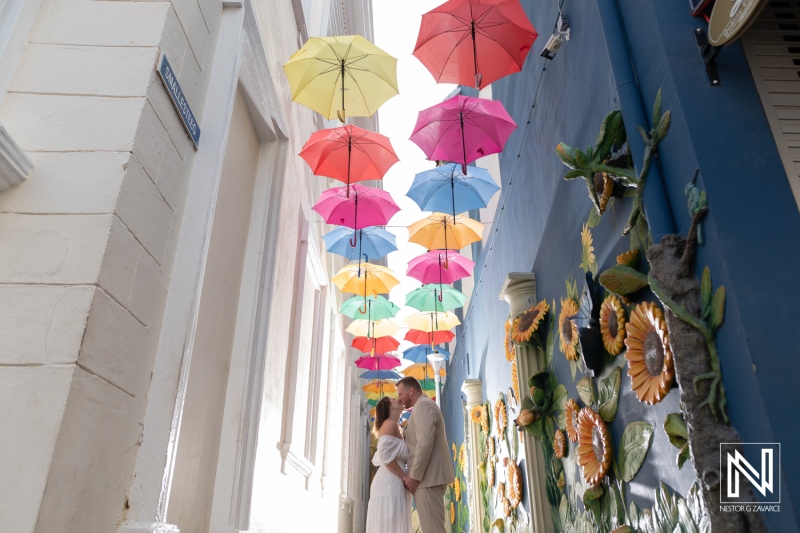 Couple beneath the Colorful Umbrellas in Punda
