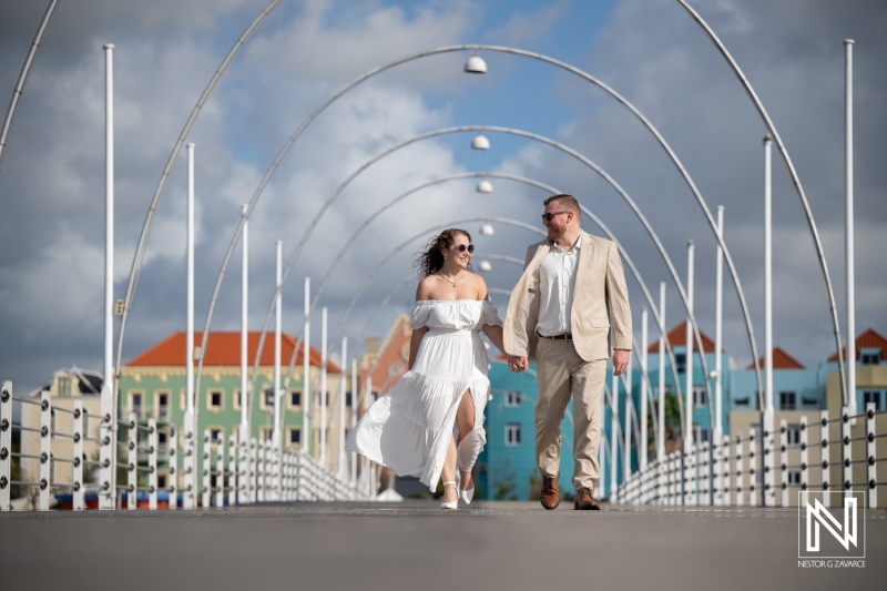 Newlyweds Walking on Queen Emma Bridge