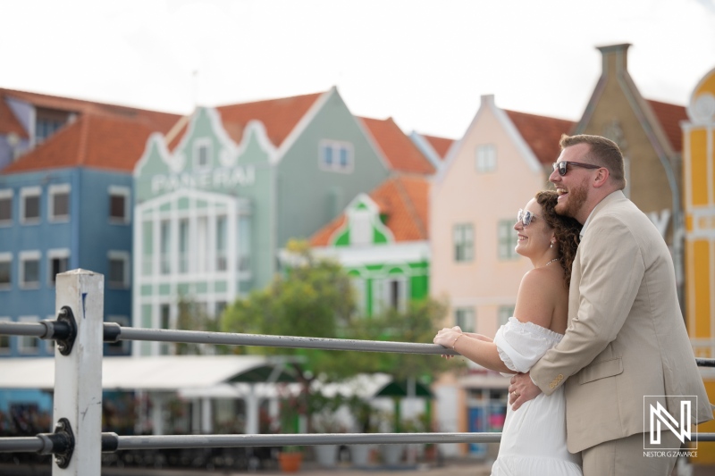 Couple Embracing beside the Colorful Waterfront