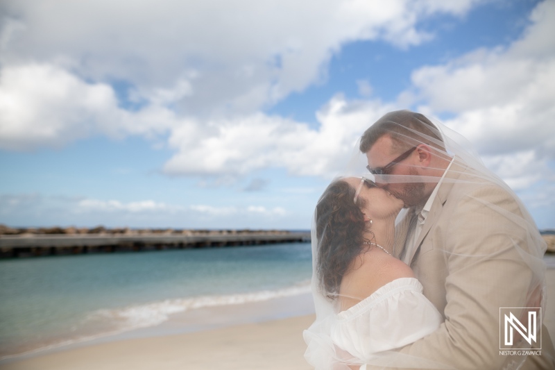 Close-Up Wedding Kiss beneath the Veil